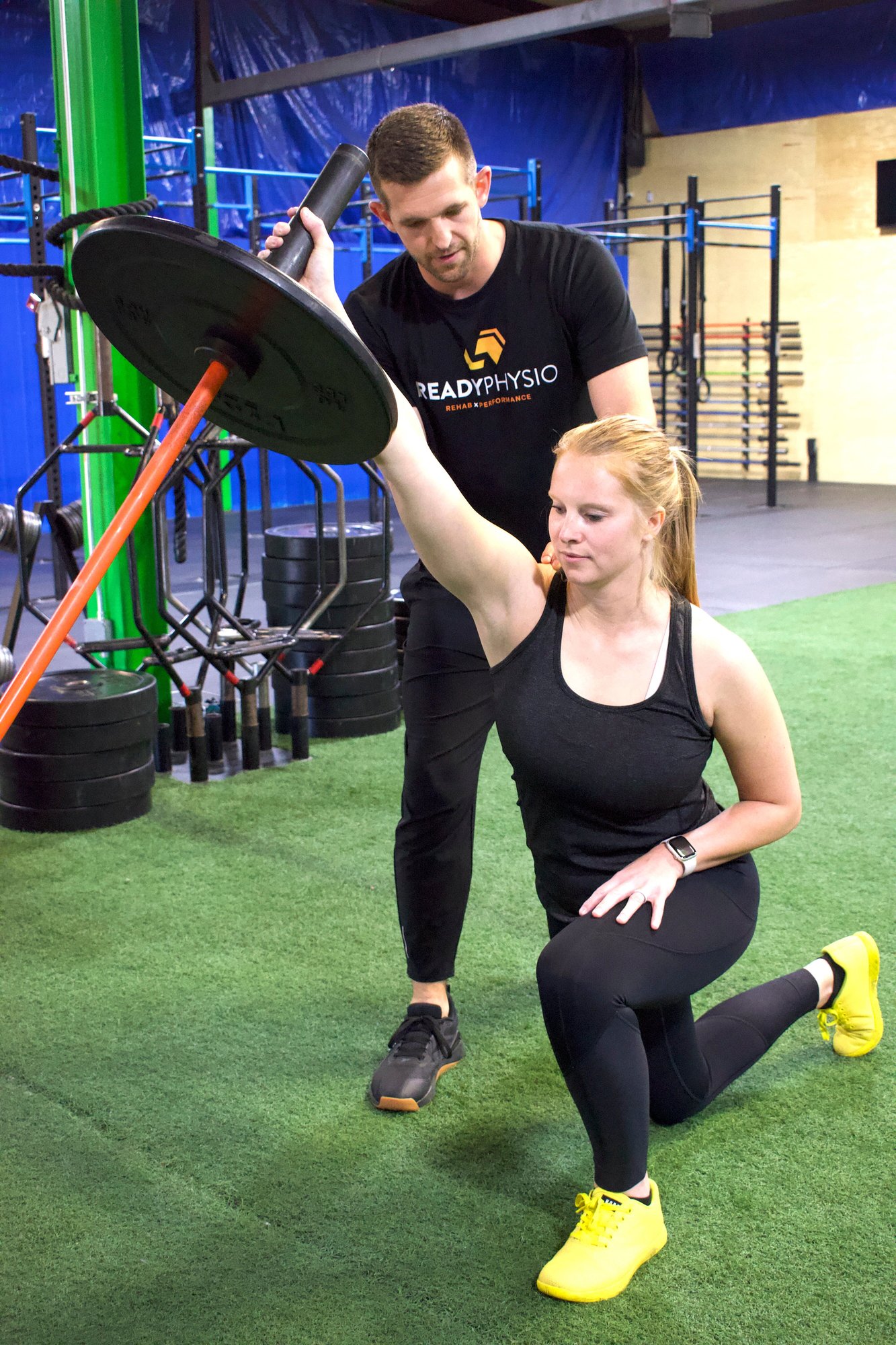 1 A kneeling shoulder press with Micah